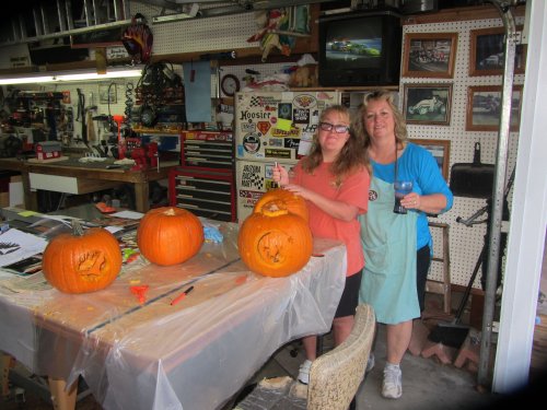 Mom and Missy carving pumpkins