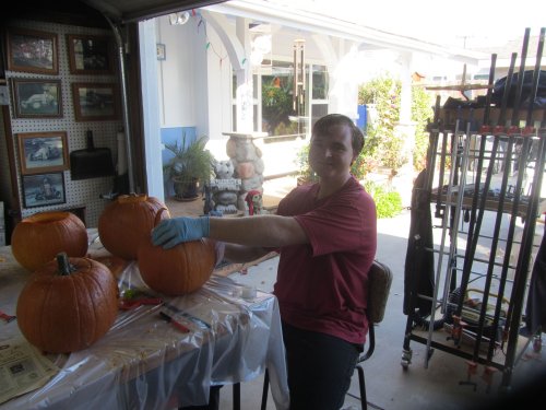 Jonny carving his pumpkin