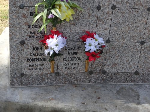 mom and dad's niches with poinsettias
