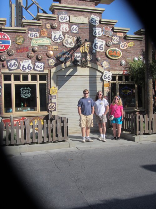 dad and kids in Cars Land