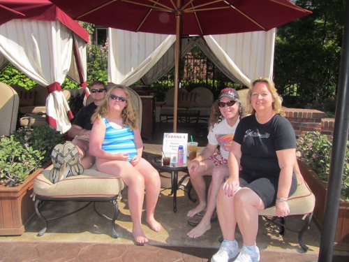 family at poolside cabana