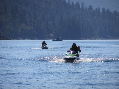 Family on watercraft at the lake