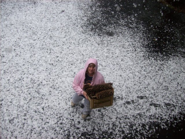 Lori on driveway as it starts to snow 