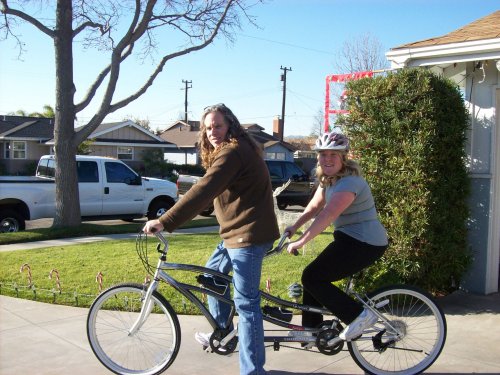 Dad and Melissa trying out the new bike 