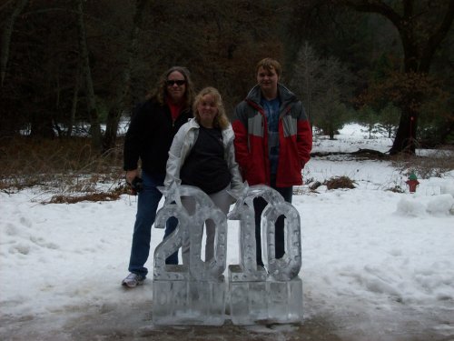 Dad and kids by ice sculpture at Ahwahnee 