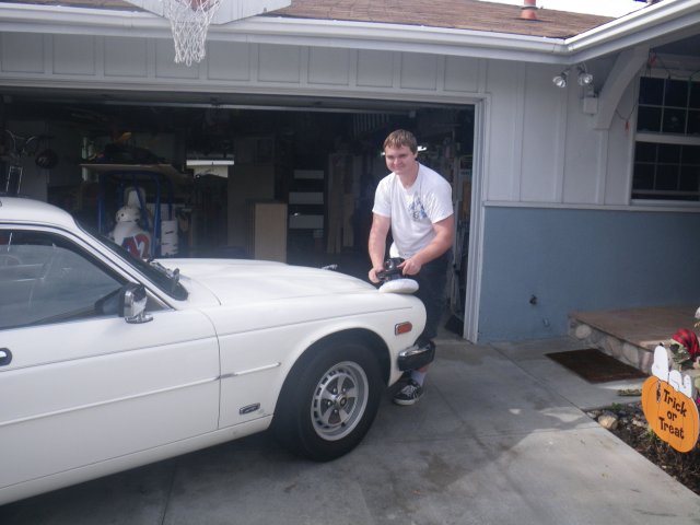 Jonny waxing his Jaguar 