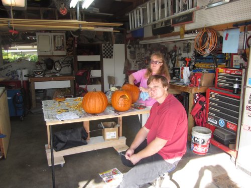 Kids carving pumpkins 