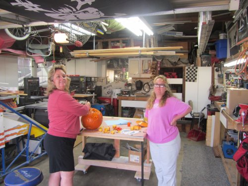 Mom and Missy carving pumpkins 