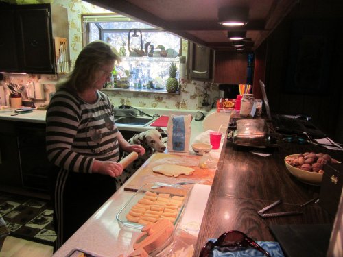 Dixie supervising mom making rolls 