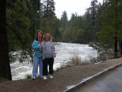 Girls by raging Merced river 