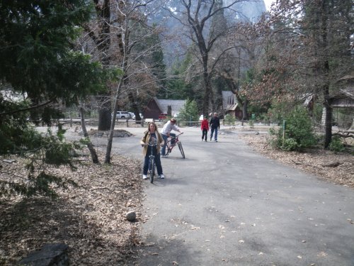 Mom and Jonny on bicycles 