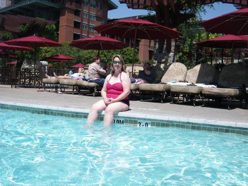 Mom sitting by the pool at the Grand Californian 