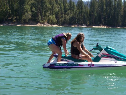 Melissa climbing on Sea Doo 