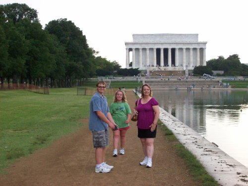 Family by reflection pond at  Lincoln Memorial 