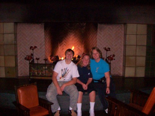 Jonny, Melissa & Lori in front of fireplace at Grand californian 