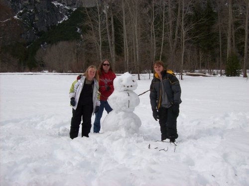 Family and snowman in Yosemite 