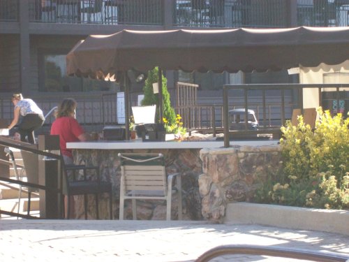 Lori ordering our lunch at poolside 