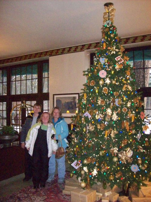 Family by Christmas tree in Ahwahnee main lobby 
